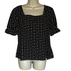 Black top NWT with short sleeves and geometrical designs size L